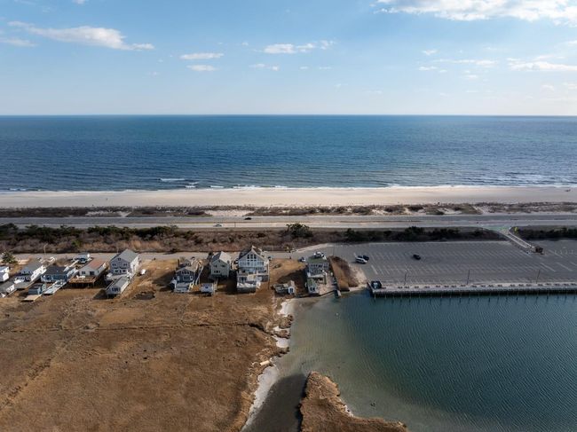 Birds eye view of property featuring a water view and a beach view | Image 9