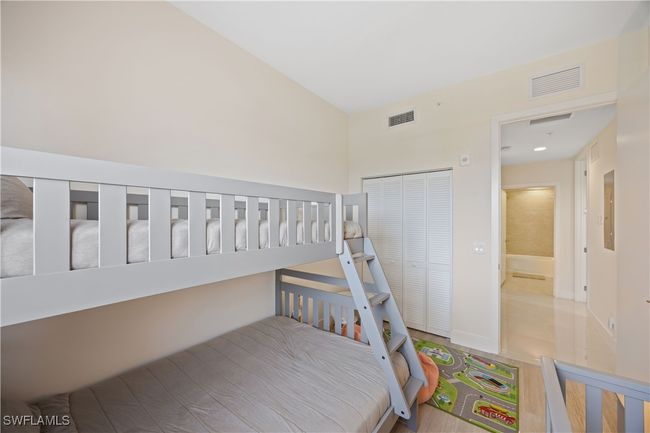 Bedroom with a closet and visible vents | Image 8