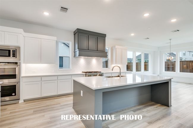 Featuring outstanding storage and prep space, your inner chef will love this over the top kitchen! REPRESENTATIVE PHOTO. | Image 7