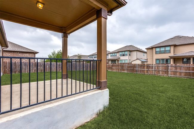 View of yard with a fenced backyard and a residential view | Image 23