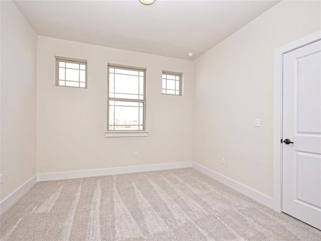 Carpeted empty room with plenty of natural light | Image 15