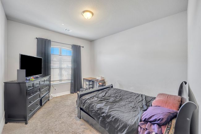 Bedroom featuring light carpet | Image 20