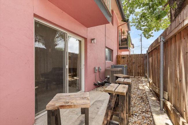 View of fenced backyard | Image 19