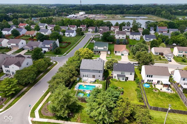 aerial perspective of suburban area with a nearby body of water | Image 49