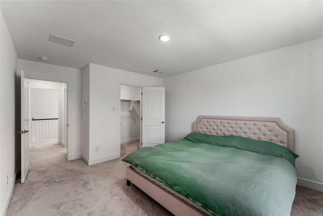 Carpeted bedroom featuring baseboards and a spacious closet | Image 25
