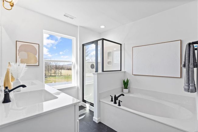 Bathroom with tile patterned flooring, vanity, and separate shower and tub | Image 16