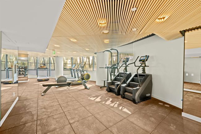 Workout area with baseboards | Image 17