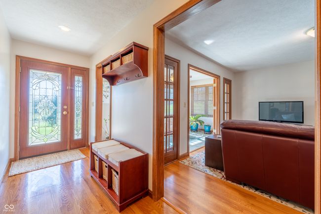 entrance foyer with recessed lighting, light wood-style flooring, a textured ceiling, and baseboards | Image 6