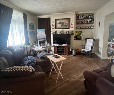 Living room featuring crown molding and wood-type flooring | Image 3