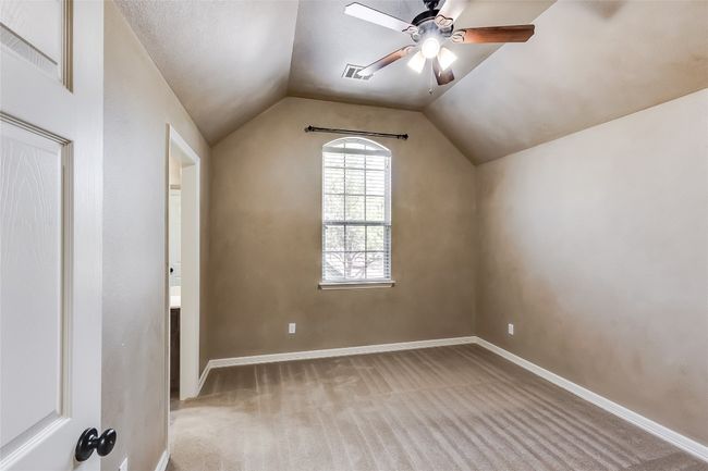 Bonus room featuring carpet floors, baseboards, vaulted ceiling, and ceiling fan | Image 29