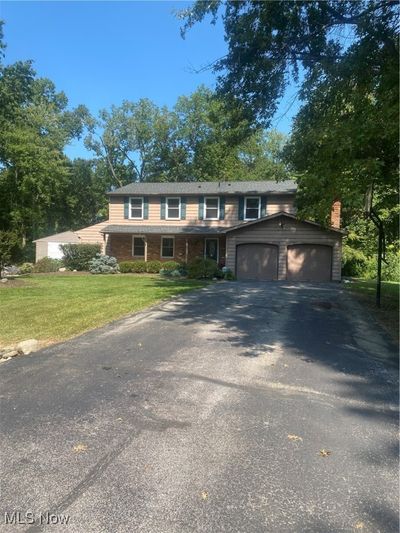 View of front property featuring a garage and a front lawn | Image 2