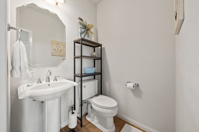 Half bath with toilet and tile patterned flooring | Image 12