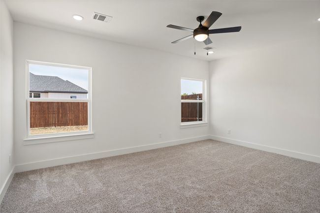 Carpeted spare room featuring ceiling fan | Image 10