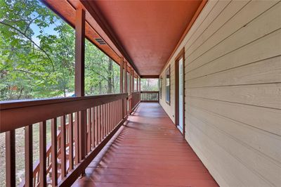 The covered front porch spans the home and is a great spot for your morning coffee | Image 3