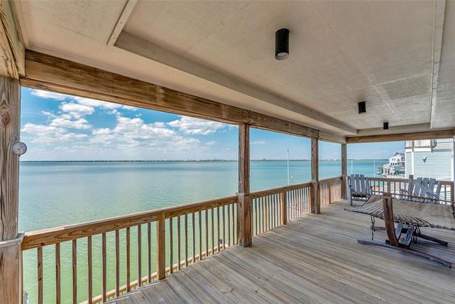 Tucked near the end of the island, this upper balcony feels like your own quiet corner of the bay. With no backyard neighbors and wide water views, it’s easy to forget the world and just relax. | Image 27
