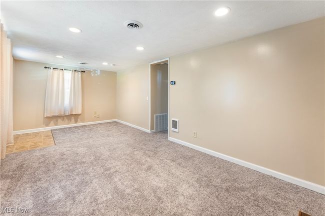 Unfurnished room with visible vents, recessed lighting, and light carpet | Image 34