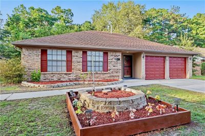 Beautiful Exterior with Garden Bed | Image 3