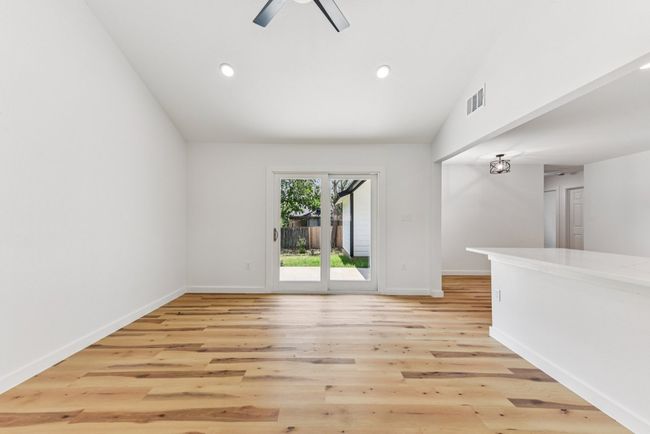 Spare room with lofted ceiling, light wood finished floors, and recessed lighting | Image 16
