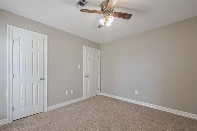 3rd bedroom offers lots of natural lighting from the large window, fan, and ample sized closet | Image 21