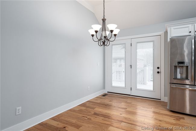 Lovely eat in area with lots of natural light and french doors leading to the back covered deck! | Image 9
