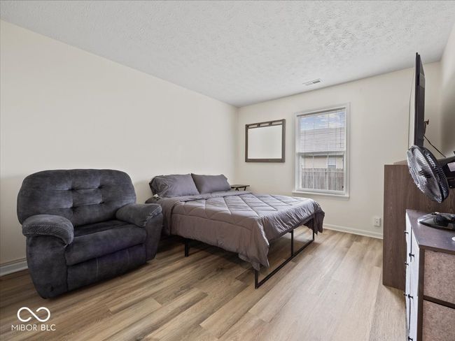 Bedroom with hardwood-style floors | Image 14