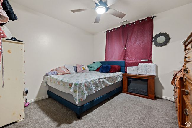 Carpeted bedroom featuring baseboards and a ceiling fan | Image 17