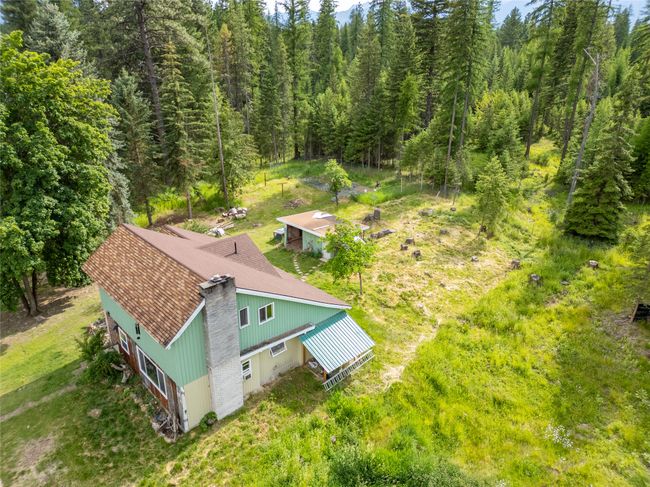 View of subject property featuring a heavily wooded area | Image 18