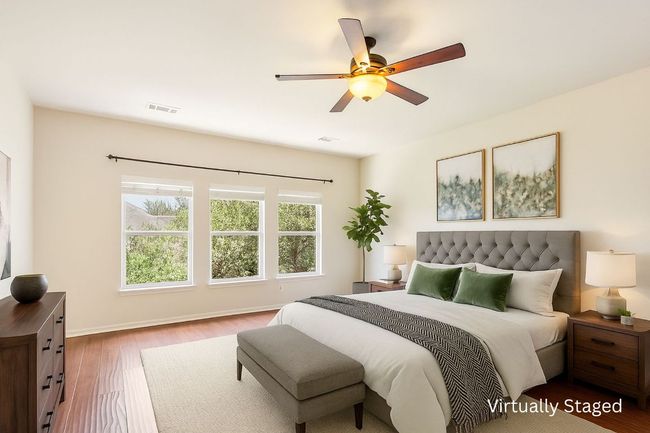 Bedroom featuring wood finished floors and ceiling fan | Image 27