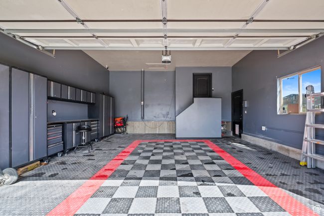 Garage with a garage door opener | Image 36