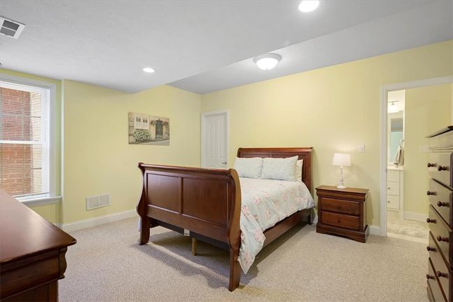 The fifth bedroom is located on the lower level. | Image 37
