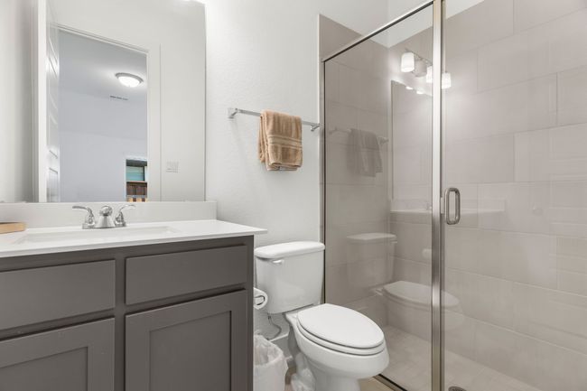 Bathroom featuring toilet, a shower stall, and vanity | Image 15