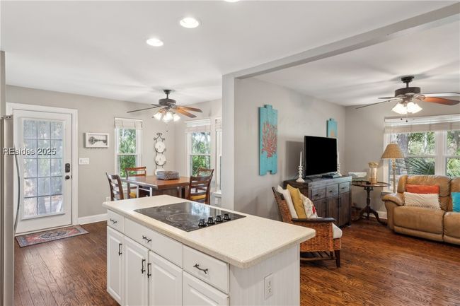 Updated chef's kitchen with stainless steel appliances & ample storage, efficient flow and a window over the sink for a view while prepping and cooking. | Image 22