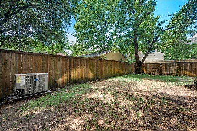 View of fenced backyard | Image 28