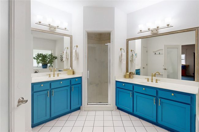 Full bath with two vanities, a shower stall, and a sink | Image 19