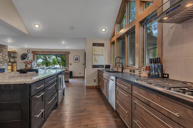 You will love cooking in a kitchen outfitted with a double oven and chef’s gas cooktop—ideal for culinary enthusiasts. | Image 8