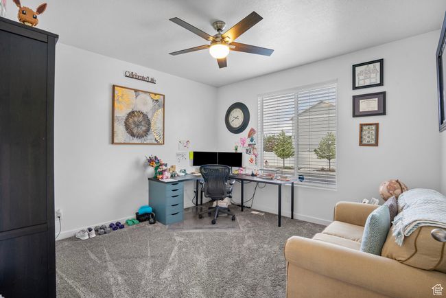 Office space with a ceiling fan, baseboards, and carpet flooring | Image 30