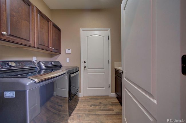Laundry room with cabinets and sink | Image 14