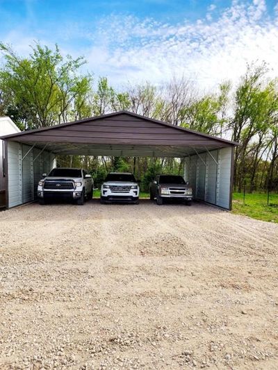 View of parking featuring a carport | Image 3