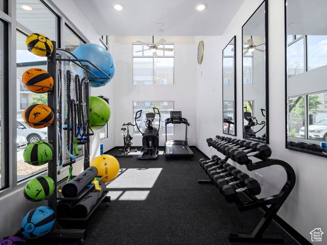 Exercise room with a wealth of natural light, recessed lighting, and ceiling fan | Image 19
