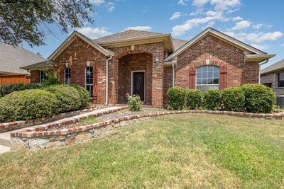 View of front of property with cooling unit and a front yard | Image 2