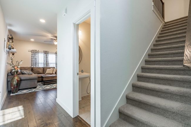 Staircase with recessed lighting, a ceiling fan, and wood finished floors | Image 13