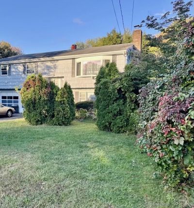 Front with attached garage and private driveway | Image 1