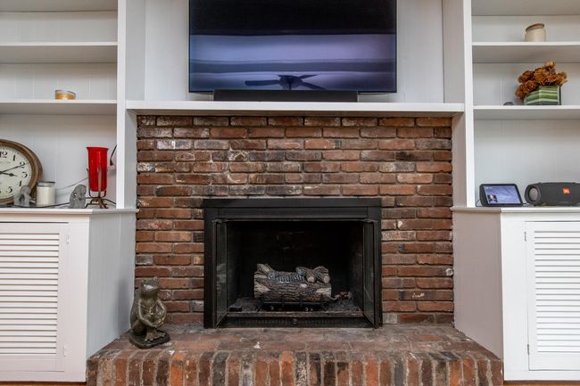 Fireplace with gas logs and built in shelving | Image 18