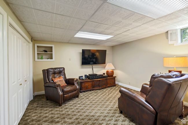 Carpeted living room featuring baseboards | Image 16
