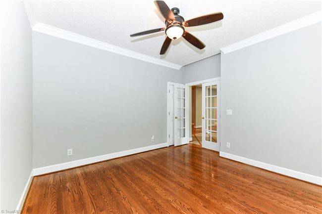 Main floor office with a closet, glass french doors and large front window | Image 21