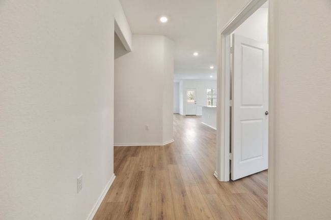 Corridor featuring light wood-type flooring and recessed lighting | Image 7
