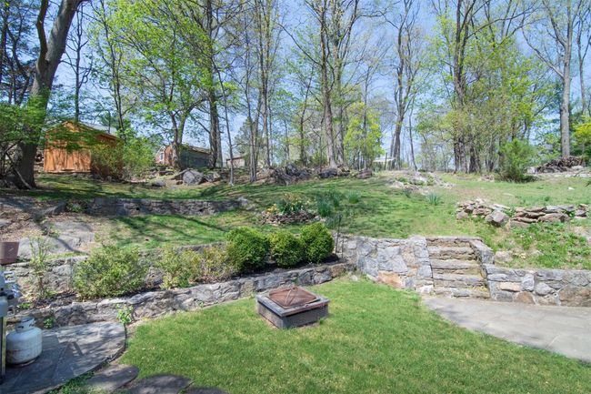 View of yard with a fire pit | Image 24