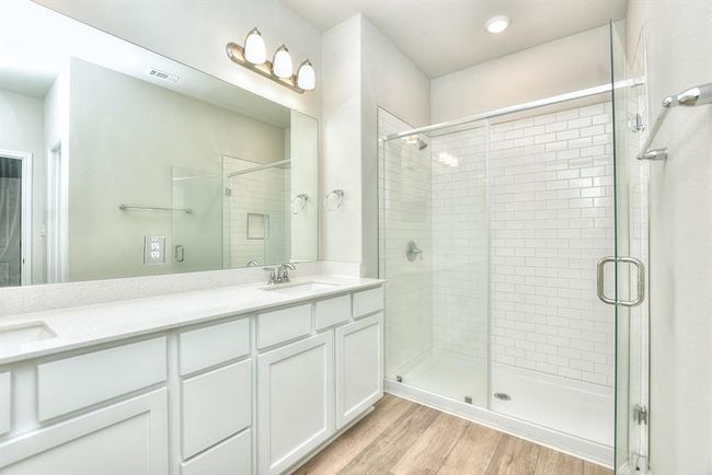 Bathroom with wood finished floors and double vanity | Image 16