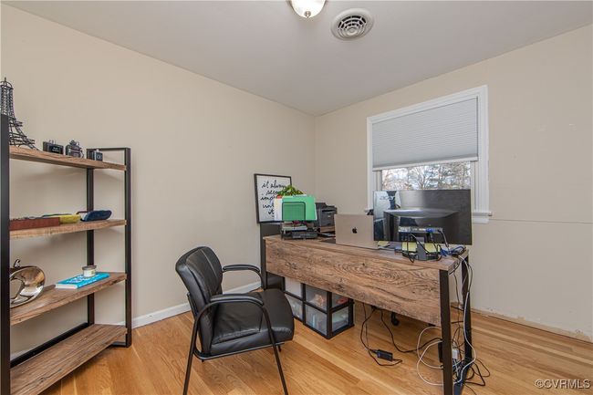 Office featuring light wood-type flooring | Image 20