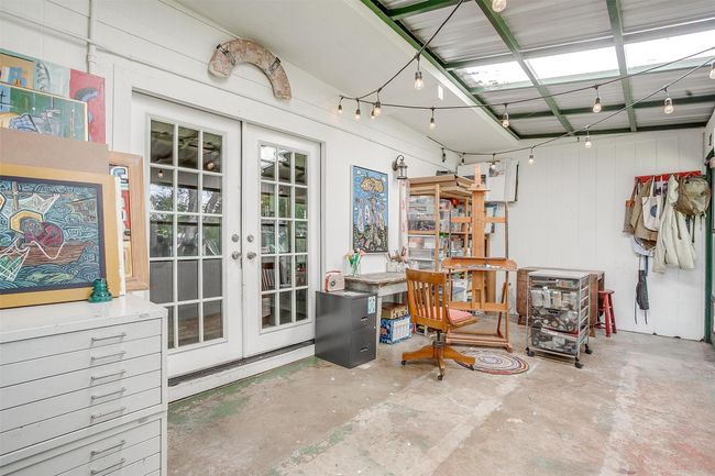 Screened in porch, used as an artist studio at present | Image 27